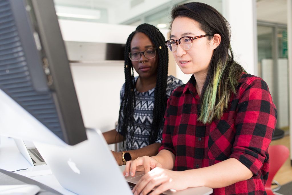 two girls working on pc