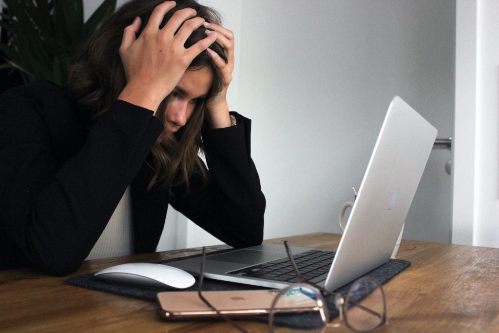 Girl using laptop nervous