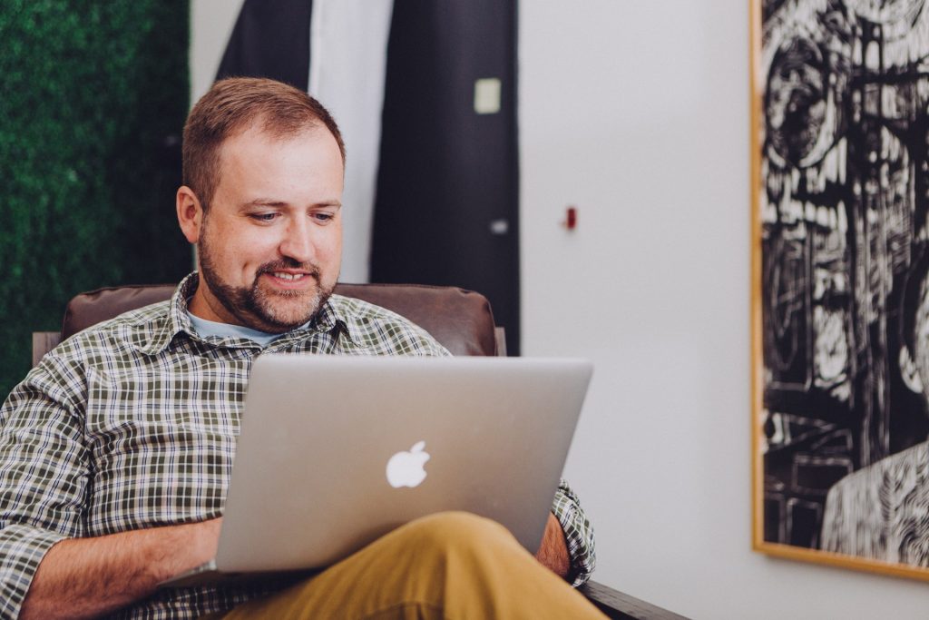 Man using silver MacBook