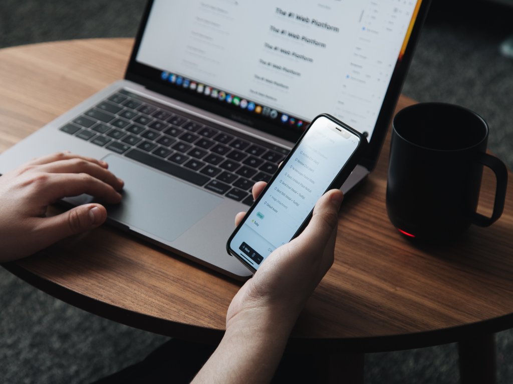 Man with laptop and phone